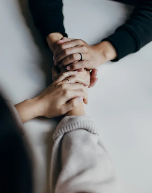 two people holding hands